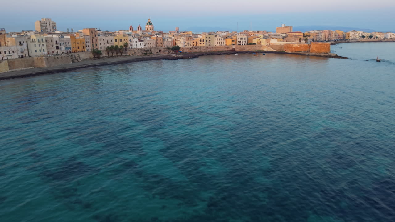 Trapani's tranquil coastline with blue sea, aerial view
