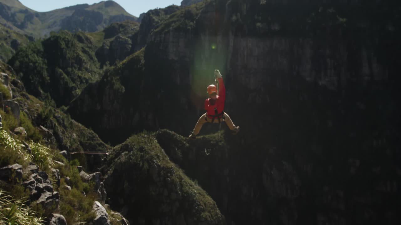 Young Caucasian man zip lining