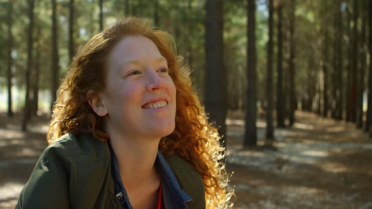 Woman relaxing in the forest 4k