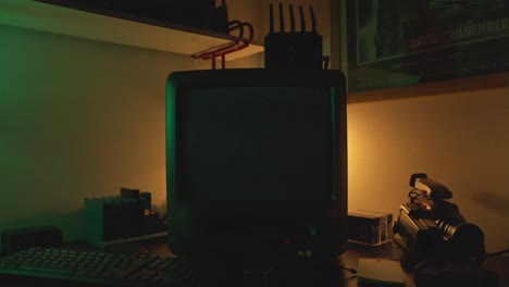 programming text displayed on computer display inside dimmed room.