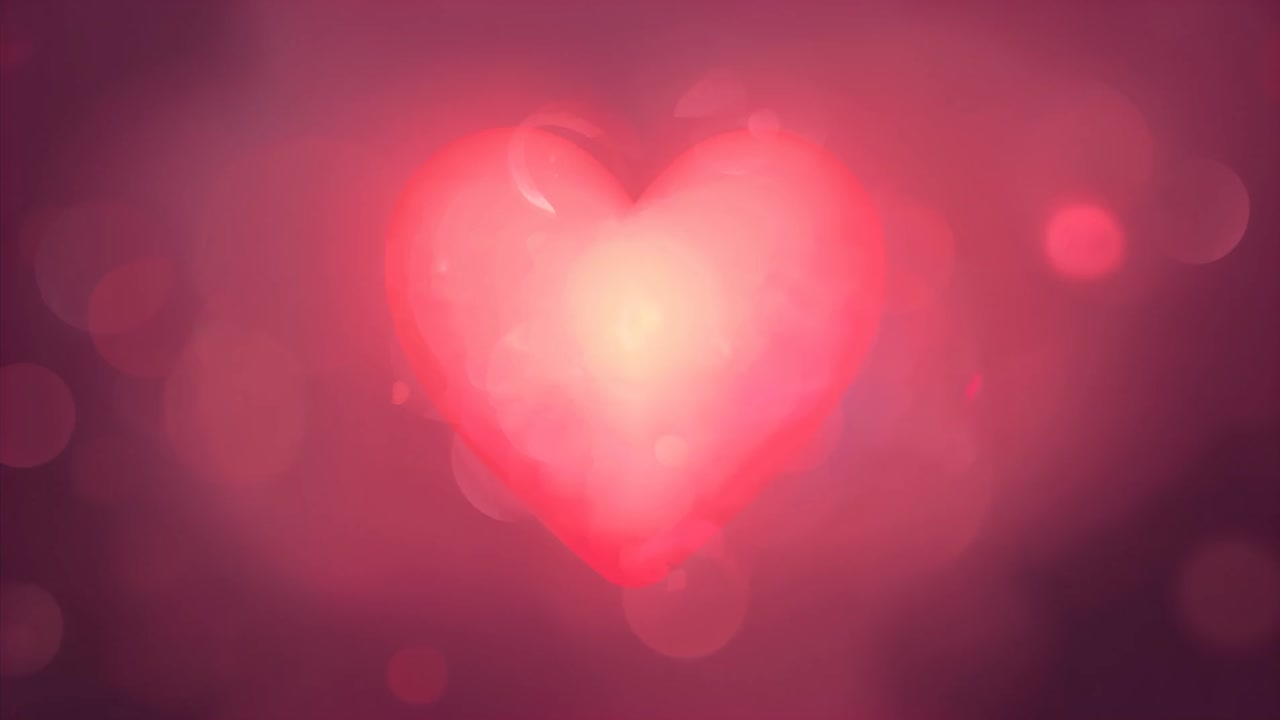 Cuore pulsante che appare e si illumina in uno sfondo rosa astratto, bokeh che si sposta per enfatizzare