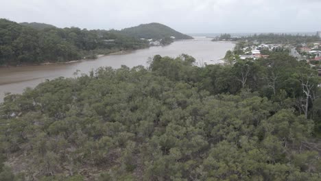 Tallebudgera-Creek-Waterway-With-Burleigh-Head-National-Park-In-The-Distance---Gold-Coast,-Queensland,-Australia