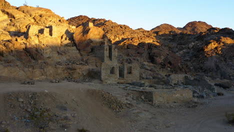 Sun-And-Shadows-Over-Ruins-At-Red-Cloud-Mine,-Arizona,-USA,-Dolly-Left