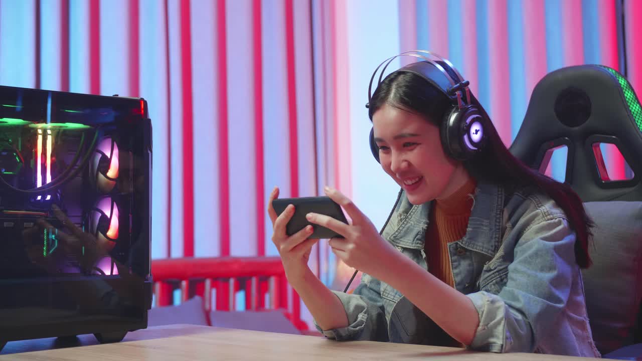 Woman Playing Mobile Games in a Gaming Setup