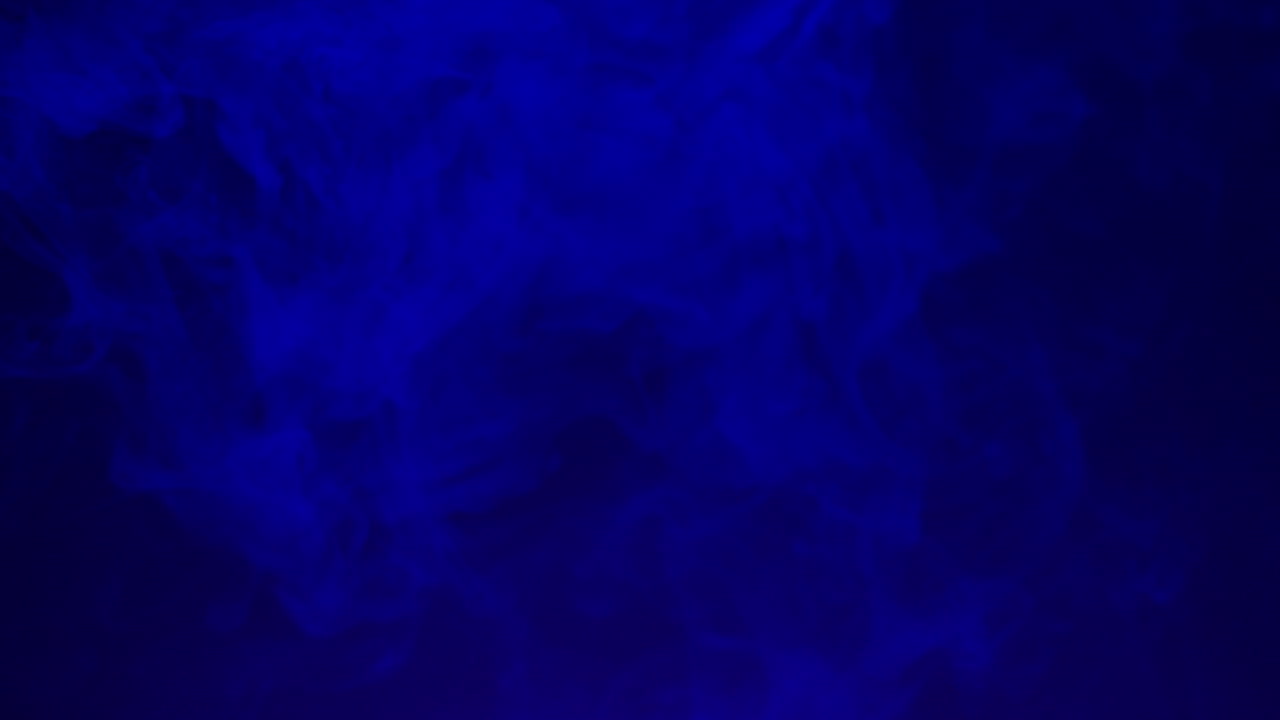 Abstract Blue Smoke Swirling Slowly on a Dark Background