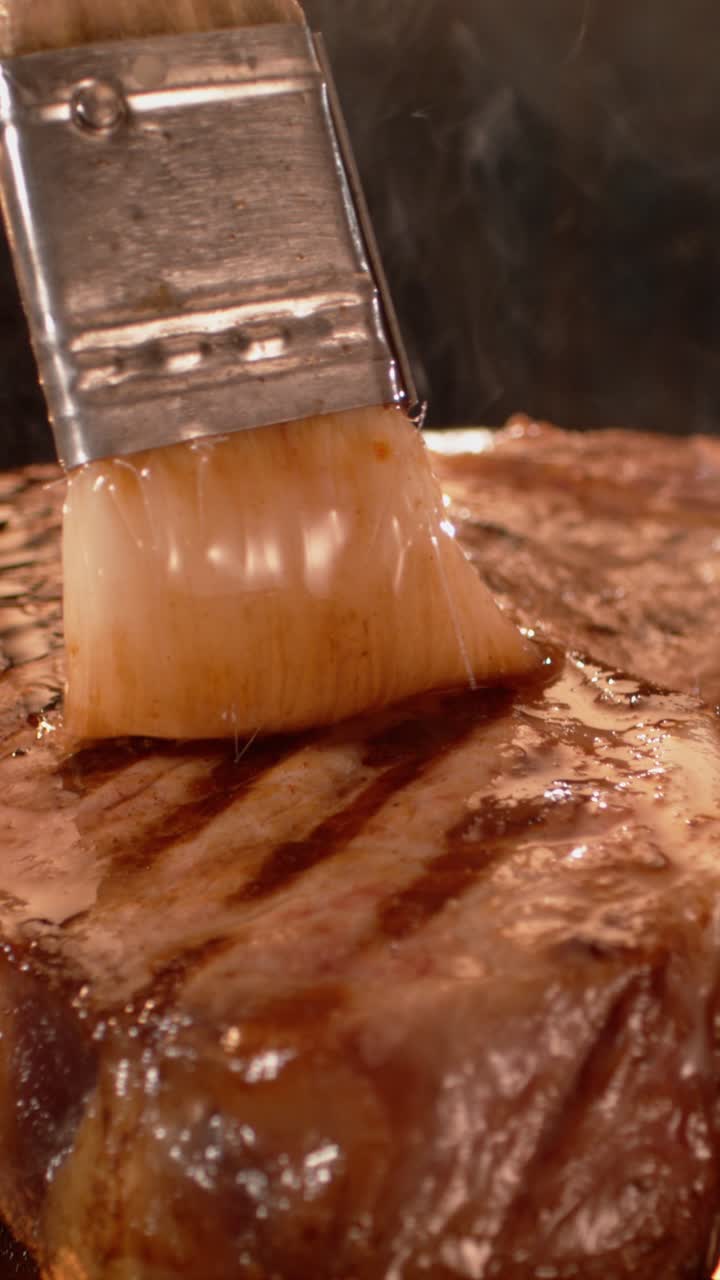 Brushing Steak on Grill