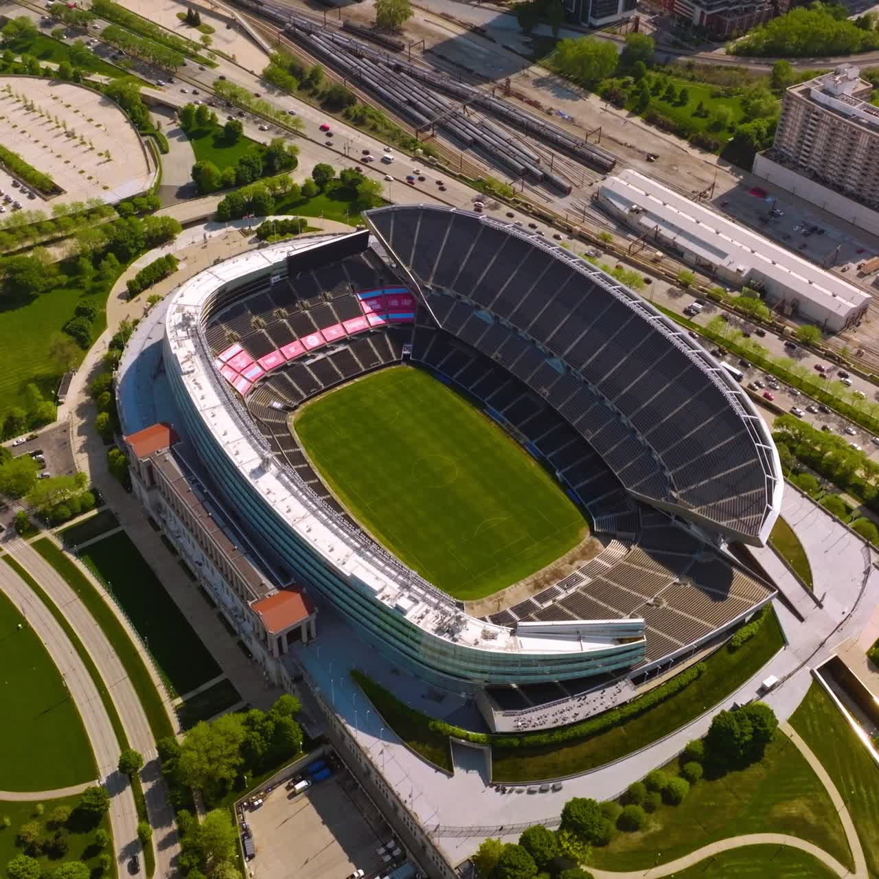 Stadium Soldier Field in Chicago. Aerial view on the structure in the green park at the backdrop of speed road