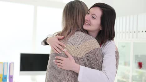 doctor and patient sharing a comforting hug