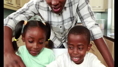 Father-using-laptop-with-his-children