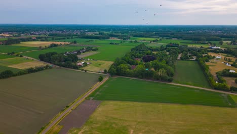 Hot-air-balloon-fly-in-far-distance,-aerial-fly-forward-hyper-lapse-view