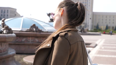 woman walking in city park