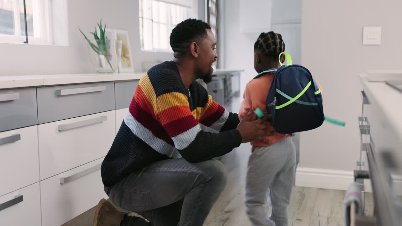 Bag, school and father help child in the morning