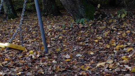 old swing-set moving in slow motion, no people in clip