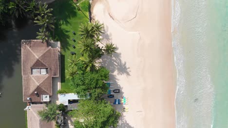 Birds-eye-view-over-empty-Pansea-Beach-in-Phuket,-Thailand