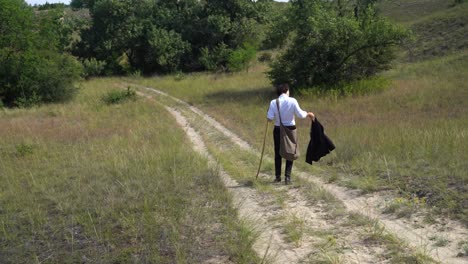 Hungarian-poet-Sandor-Petofi-walks-down-rutted-dirt-road