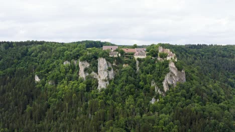 Aerial-View-of-Historic-Castle-on-Steep-Hills-in-South-Germany