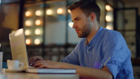 business man typing on laptop in office. tired entrepreneur working on computer.