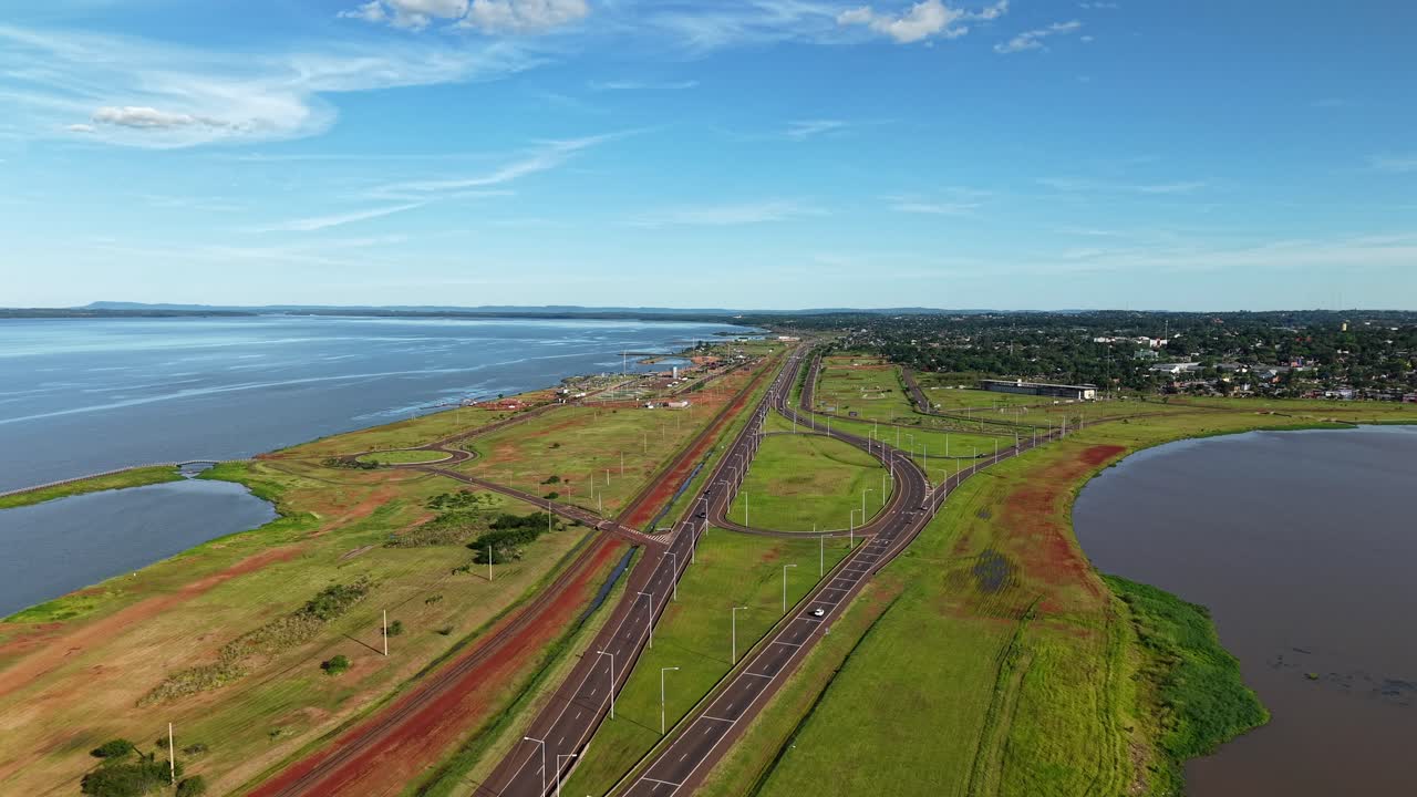 Drone fly in panorama view across the Acceso Sur road toward local touristic area, Posadas, Misiones, Argentina