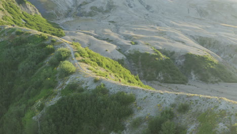 mountainbikers riding volcanic ridge at mount st