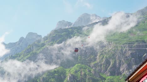 clouds and gondola with mt. pilatus in background