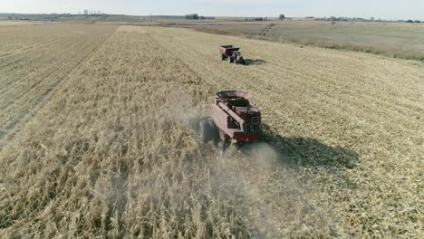 combine harvesting corn in autumn aerial