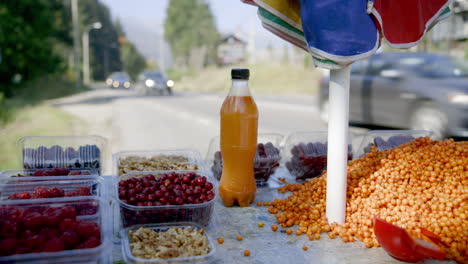 a roadside fruit stall in dappled sunlight, romania