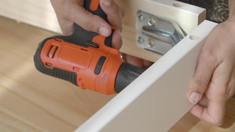 assembling furniture with an electric screwdriver
