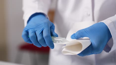 a syringe is cleaned on a cloth