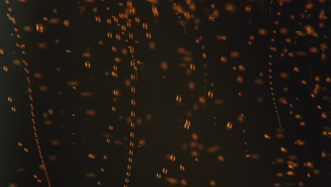 macro shot of ascending red bubbles underwater