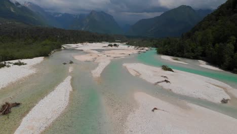 narnia movie location, drone flying above soca river in slovenia, overcast summer day
