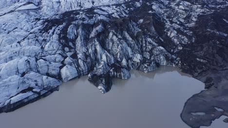 amazing ice-carved and carvasses landscape at solheimajokull glacier outlet in southern iceland at daytime