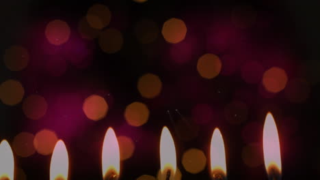 animación de velas encendidas con puntos de luz parpadeantes