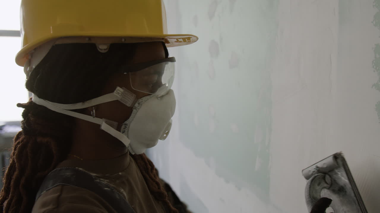 Construction worker plastering a wall