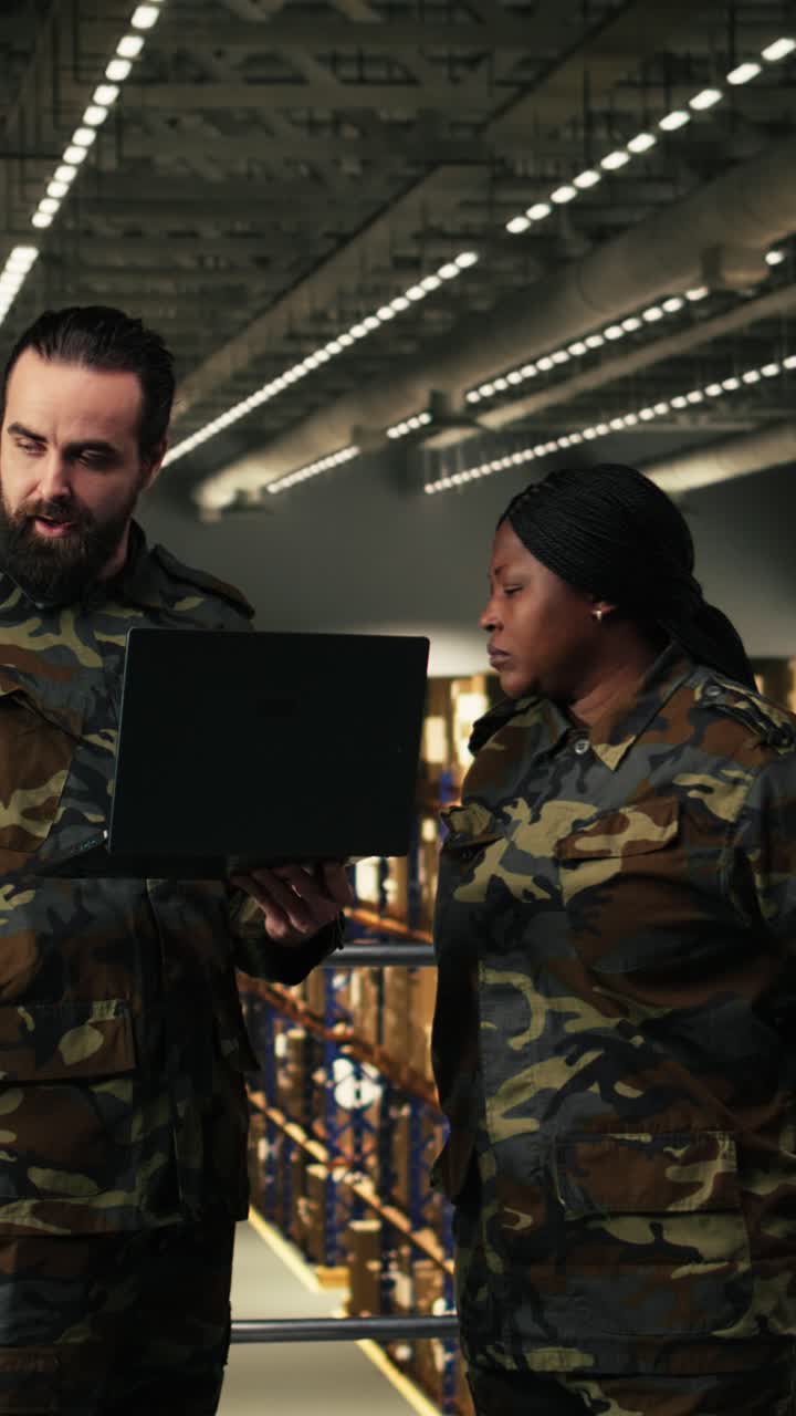 Vertical Video Armed forces diverse personnel working in military warehouse