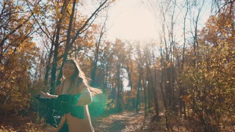 woman enjoying a beautiful autumn day in the forest