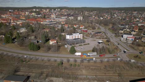 Semi-trailer-truck-and-Fire-Trucks-with-Flashing-Lights-on-Highway-in-City,-Aerial-Orbiting