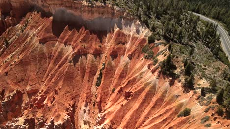 aerial cinematic drone footage highlights an abstract red rock formation in bryce canyon