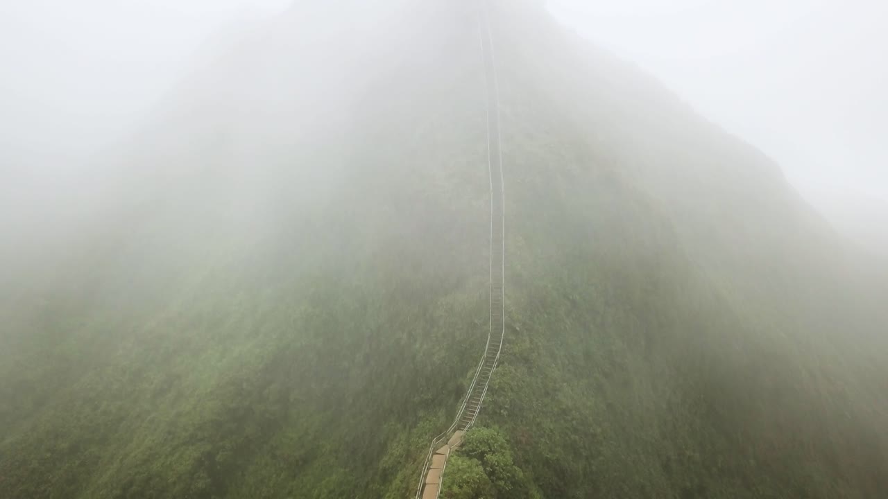 Clouds moving over the Haiku Stairs trail, also known as Stairway to Heaven. Aerial Shot, Oahu, Hawaii.