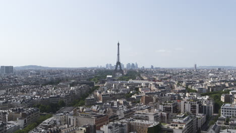 elevation drone shot of paris eiffel tower and its landscape