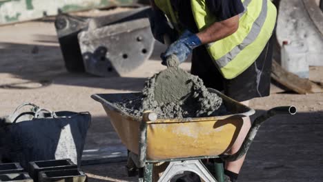 construction worker makes cement mix