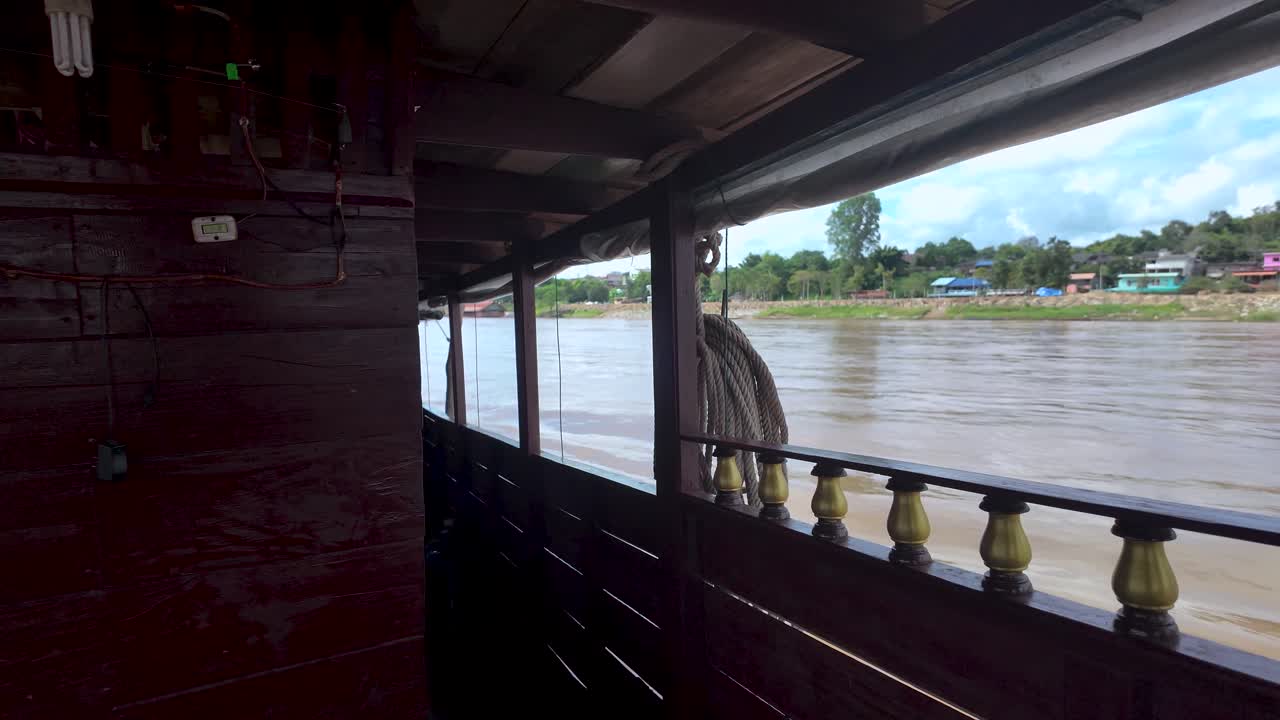 View of the Mekong River from a slow boat in Houayxay Laos capturing the essence of Southeast Asia travel and adventure