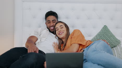 Happy-couple,-laptop-and-relax-in-bedroom