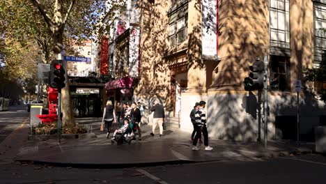 people crossing street at traffic light