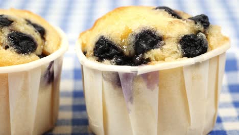 close up of muffins on table isolated on black