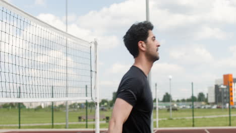 Close-up-view-of-brunet-man-hitting-a-volleyball