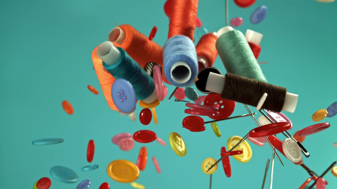 Colorful Sewing Supplies Falling in Slow Motion