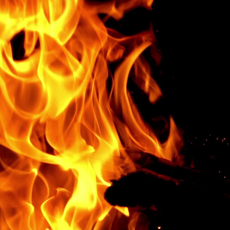 Burning Wood. Flame heats the rural farmhouse. Slow motion