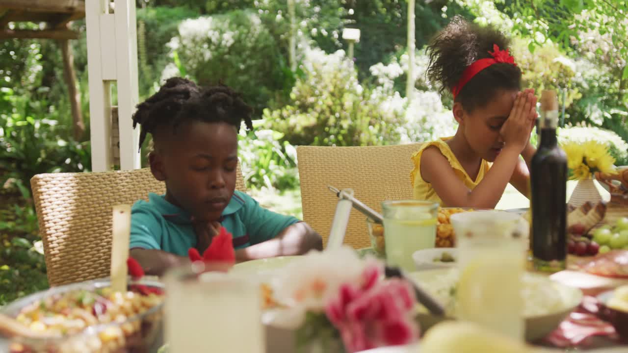 African American family spending time in garden together