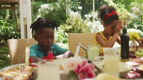 african american family spending time in garden together