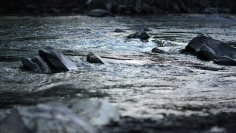 rapid mountain river flowing through stone rapids. view of mountain river.